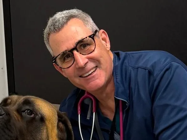 Dr Charles Kuntz, presenter of Nexus CPD event with a dog.